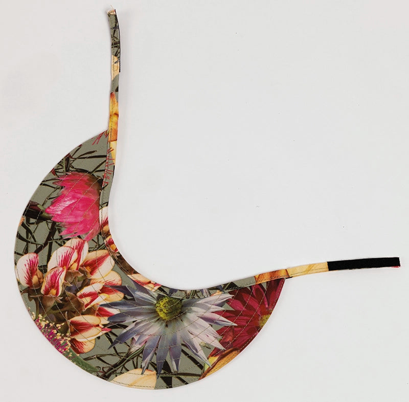 The Florence canvas sun visor hat depicts bright wildflower photographs.