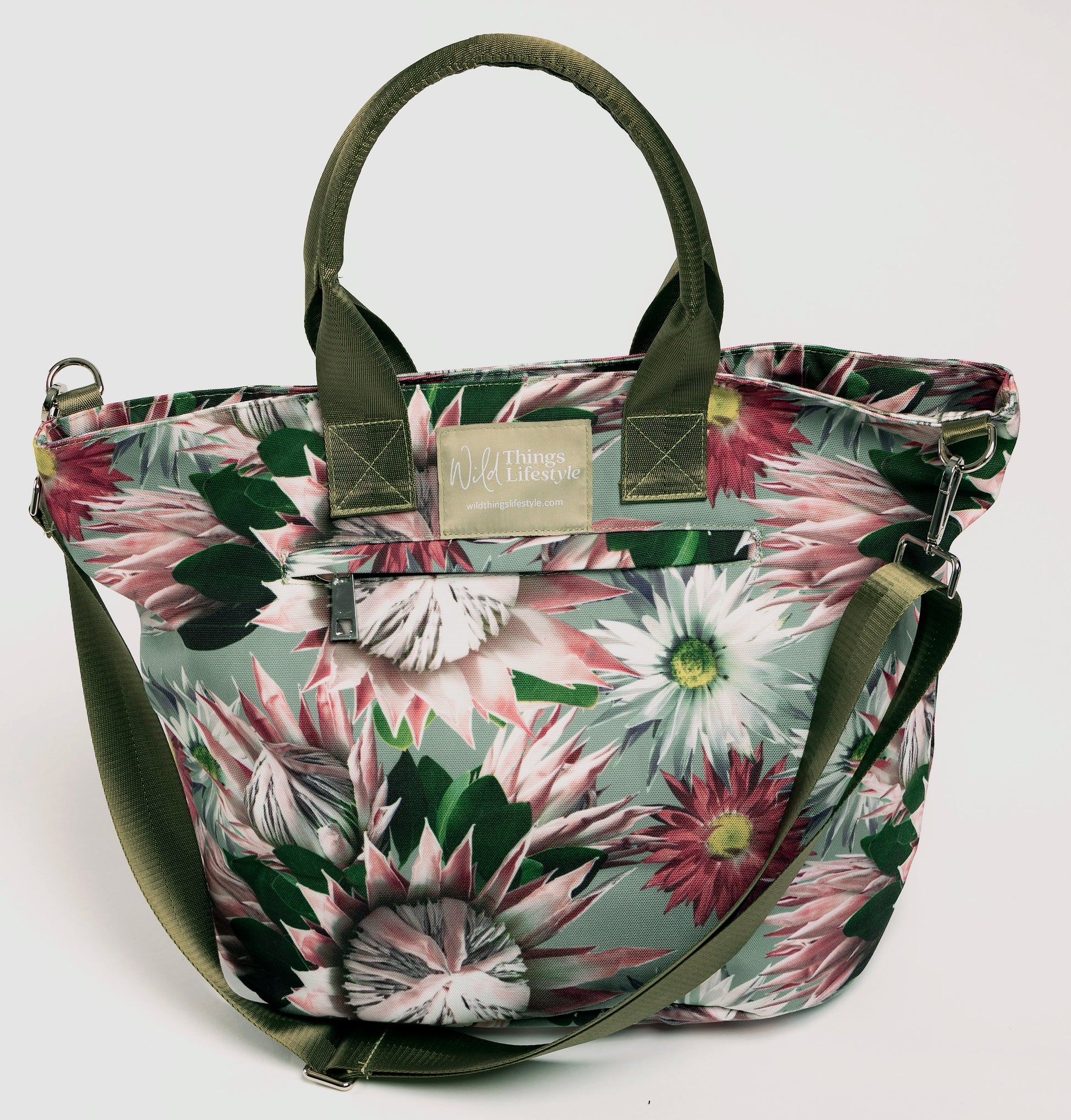 The Bernadette large canvas lifestyle tote bag is embellished with Proteas and has an external zip pocket and the cross-body strap.