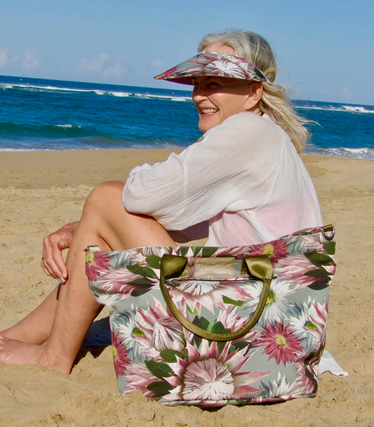 Wild Things Large Canvas Tote Bag, Bernadette, on the beach with women wearing a peak hat and white shirt