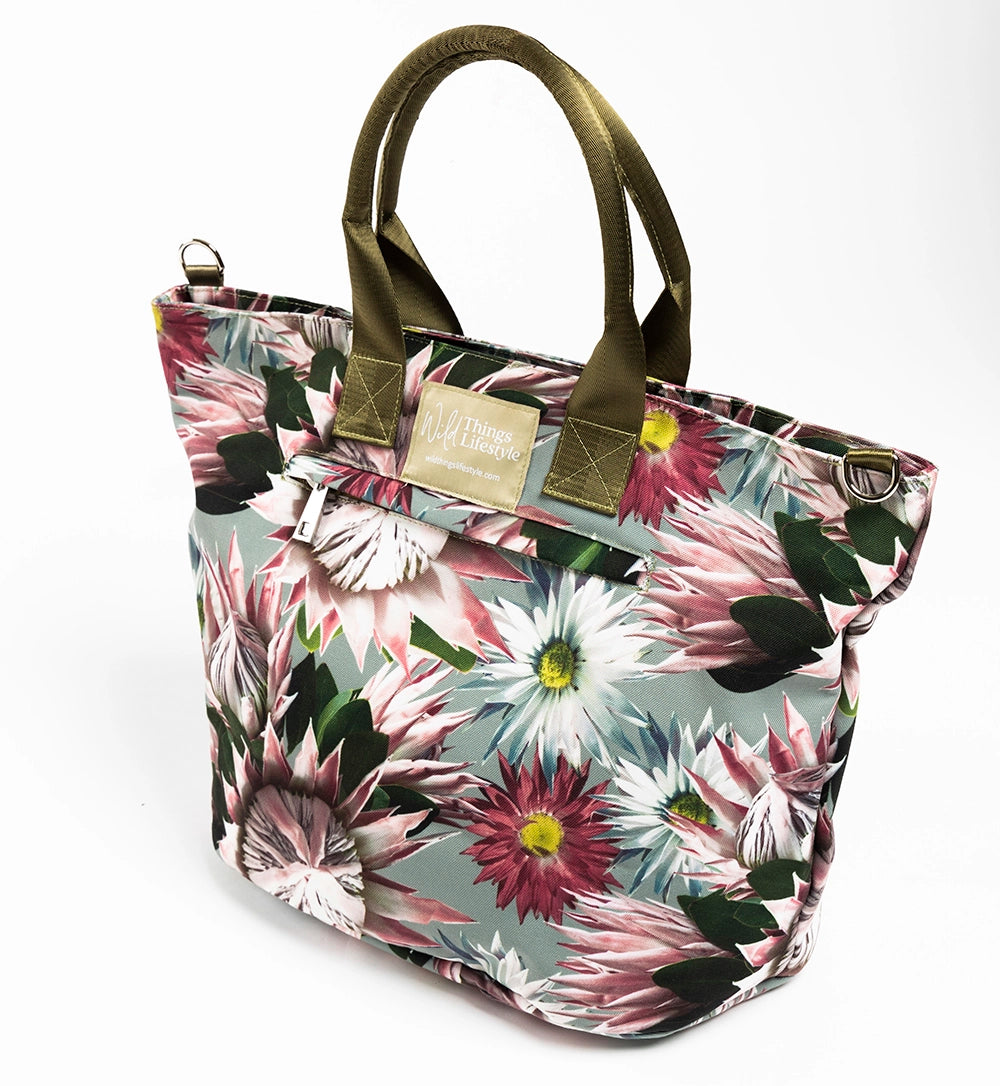 Bernadette lifestyle tote bag depicting pink Protea flowers on a soft green background.