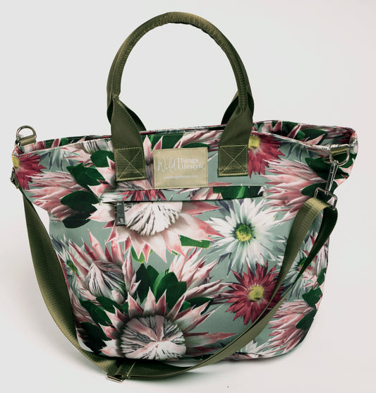 The Bernadette large canvas lifestyle tote bag is embellished with Proteas and has an external zip pocket and the cross-body strap. 