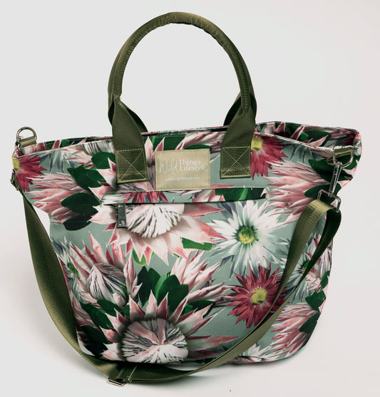 The Bernadette large canvas lifestyle tote bag is embellished with Proteas and has an external zip pocket and the cross-body strap.
