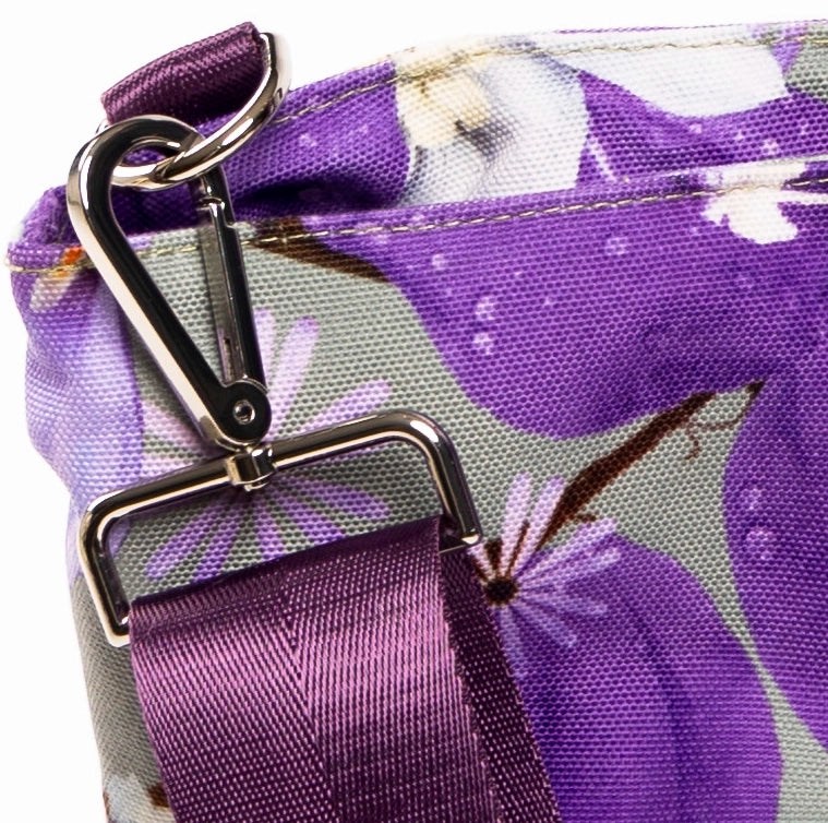 A close up of the canvas fabric and quality fittings on the Phoebe large canvas tote bag. The bag colours are purple and soft green.